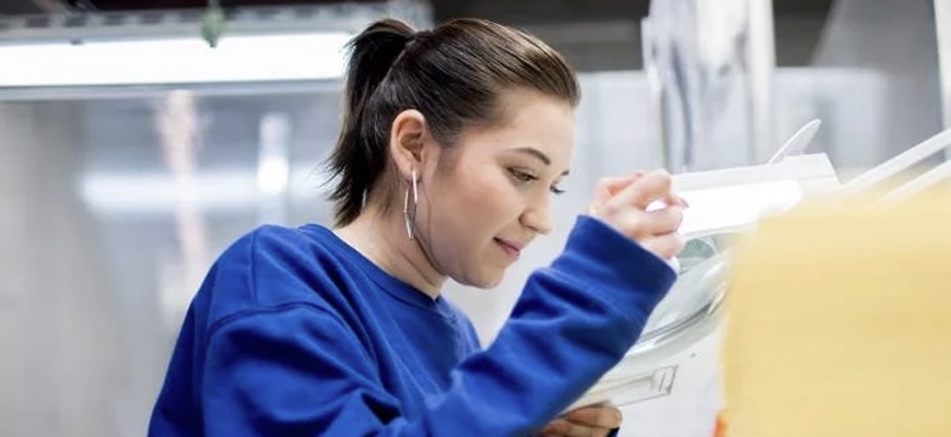 Person looking through paperwork.